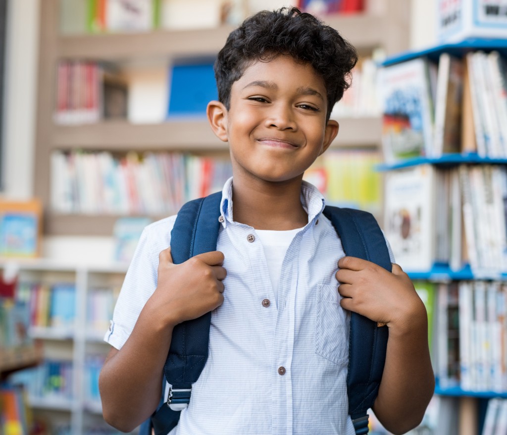 Smiling hispanic boy at school