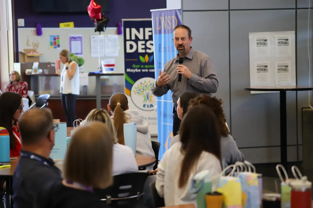 Superintendent--Dr.-Jon-Holmen--presenting-to-staff-at-EIA-Rev